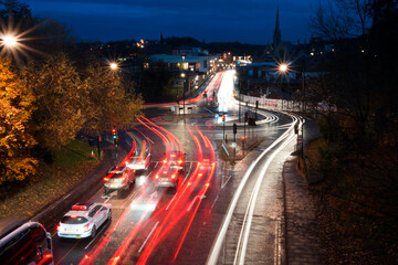Durham cityscape in evening with car light trails in the street. Long exposure.