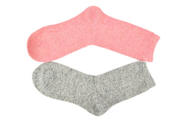 Gray and pink woolen socks on a white background