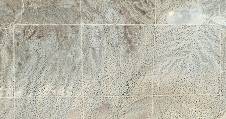 parceling out nothingness,  United States, abstract photography of relief drawings in  fields in...