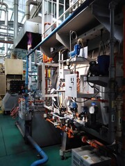 View of automatic mechanical instruments in modern production plant manufacturing process. For modern industrial, machinery, engineering and safety background.