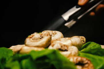 roasted mushrooms served on a green salad