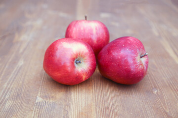 red apples on wooden table