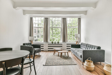 Living room with carpet, mild sofa, table, and other luxury furniture