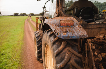 Modern farm tractor in the field prepared for work on the farm. Organic fruit production and orchards