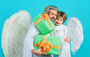 Happy father and son angels with presents. Valentines day. Valentine cupid with gift box.