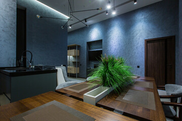 interior photography, large kitchen studio together with living room in loft style, in dark colors
