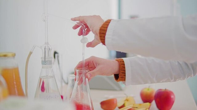 laboratory assistant,test tube. aplle juise test
