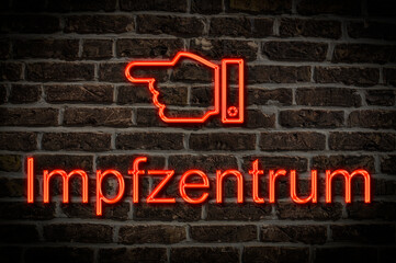 Fototapeta premium Leuchtreklame Impfzentrum