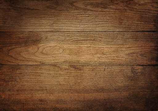 Brown scratched wooden cutting board.
