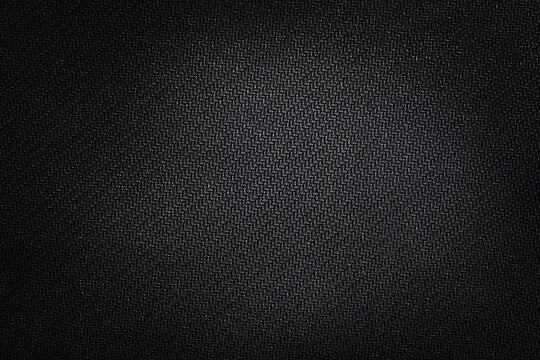 Texture technical fabric with rubber coating. Black background.