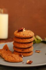 Homemade chocolate chip cookies stacked in a rusty setting