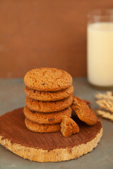 Fototapeta na wymiar Homemade chocolate chip cookies stacked in a rusty setting