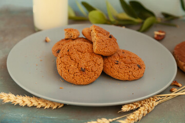 Homemade chocolate chip cookies stacked in a rusty setting
