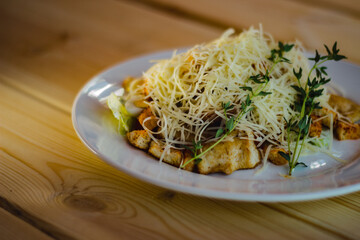 salad with fried shrimps and grated cheese and vegetables