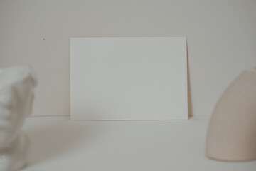 Blank white card in boho style interior