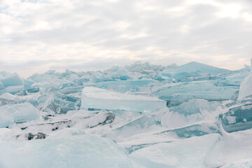 Fototapeta na wymiar Chunks of blue ice on the shore of Lake Michigan