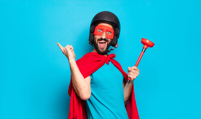young bearded man. crazy and humorous super hero with helmet and mask