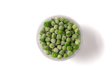 Frozen green beans in plastic box isolated on white background.