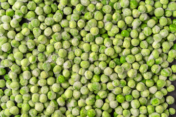 Frozen green peas background.