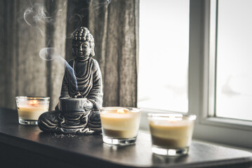 Candlestick in the shape of a buddha