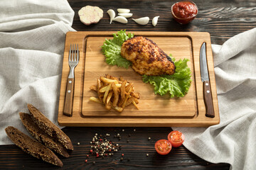 sliced chicken breast on wooden cutting board