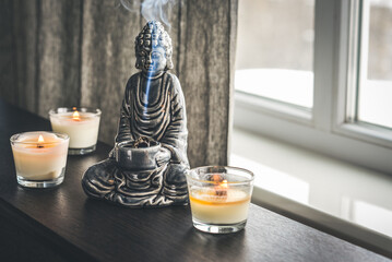 Candlestick in the shape of a buddha