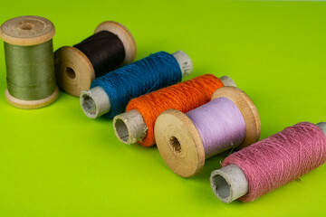 Several skeins of colored thread close-up.