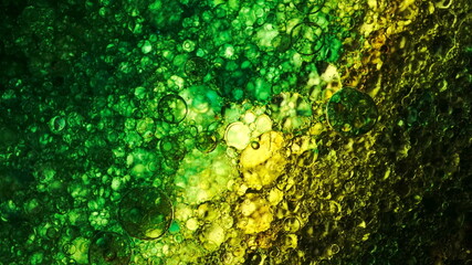 Colorful oil bubbles with tablet backlight
