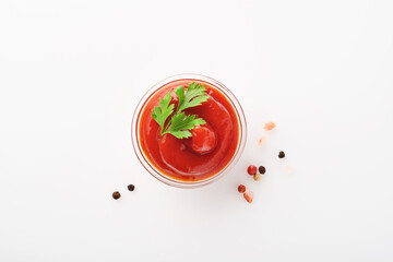Tomato ketchup tasty in bowl isolated on white. Mock up. Isolated on white background.