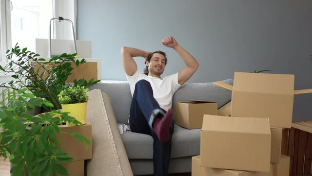 Happy man moving in to new apartment