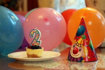Fototapeta na wymiar birthday cake with candles and balloons