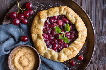 Traditional homemade Galette pie with red grapes