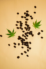 CBD infused coffee. Flat lay marijuana leaf and beans. Stress reduce medicine. Hemp beverage. Vertical orientation 