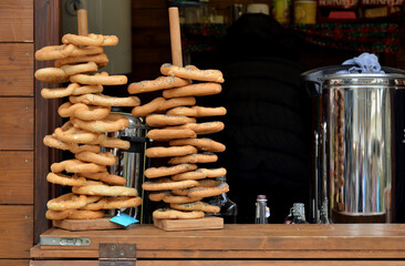 Bagels with poppy seeds and beans on counter with coffee hopper