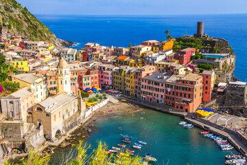 Colorful villages in Cinque terre, Italy and seascape at sunset - obrazy, fototapety, plakaty