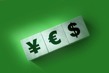 Yen, euro and dollar printed on wooden cubes. Currency trade concept