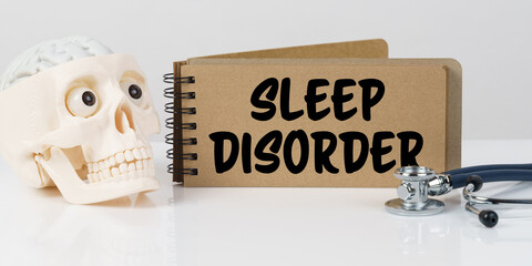 On the table lies a skull, a stethoscope and a notebook with the inscription - SLEEP DISORDER