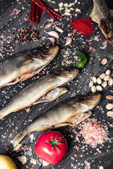 Dried fish on a wooden background. Different kinds of dried fish