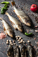 Dried fish on a wooden background. Different kinds of dried fish