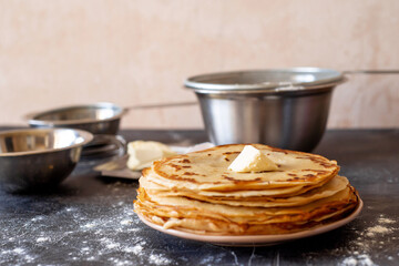 stack of pancakes and ingredients for making dough, Maslenitsa