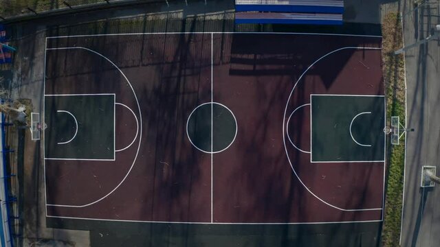 Public Basketball Court Aerial Top View. Flight above empty outdoor Sport court on drone.