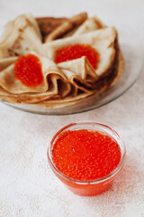 Russian traditional Maslenitsa: pancakes with red caviar