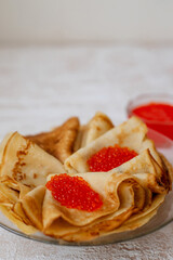 Russian traditional Maslenitsa: pancakes with red caviar