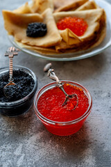 Russian traditional Maslenitsa: pancakes with red and black caviar