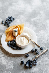 Pancakes with fresh berries. National Russian cuisine, the holiday of Maslenitsa.