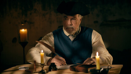 An 18th century scene of a mature man in a tricorn or cocked hat writing a letter using a feather quill pen