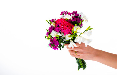 hand holding bouquet of flowers