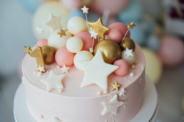 Colorful decoration of a first year birthday cake