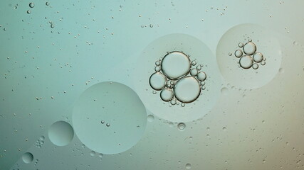 Oil bubbles in the water with some gradient backlight