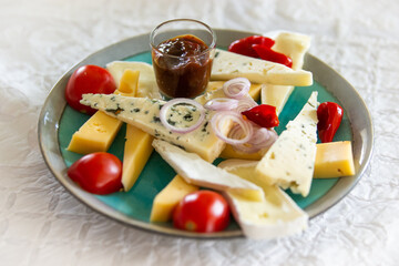 a plate full of french cheeses